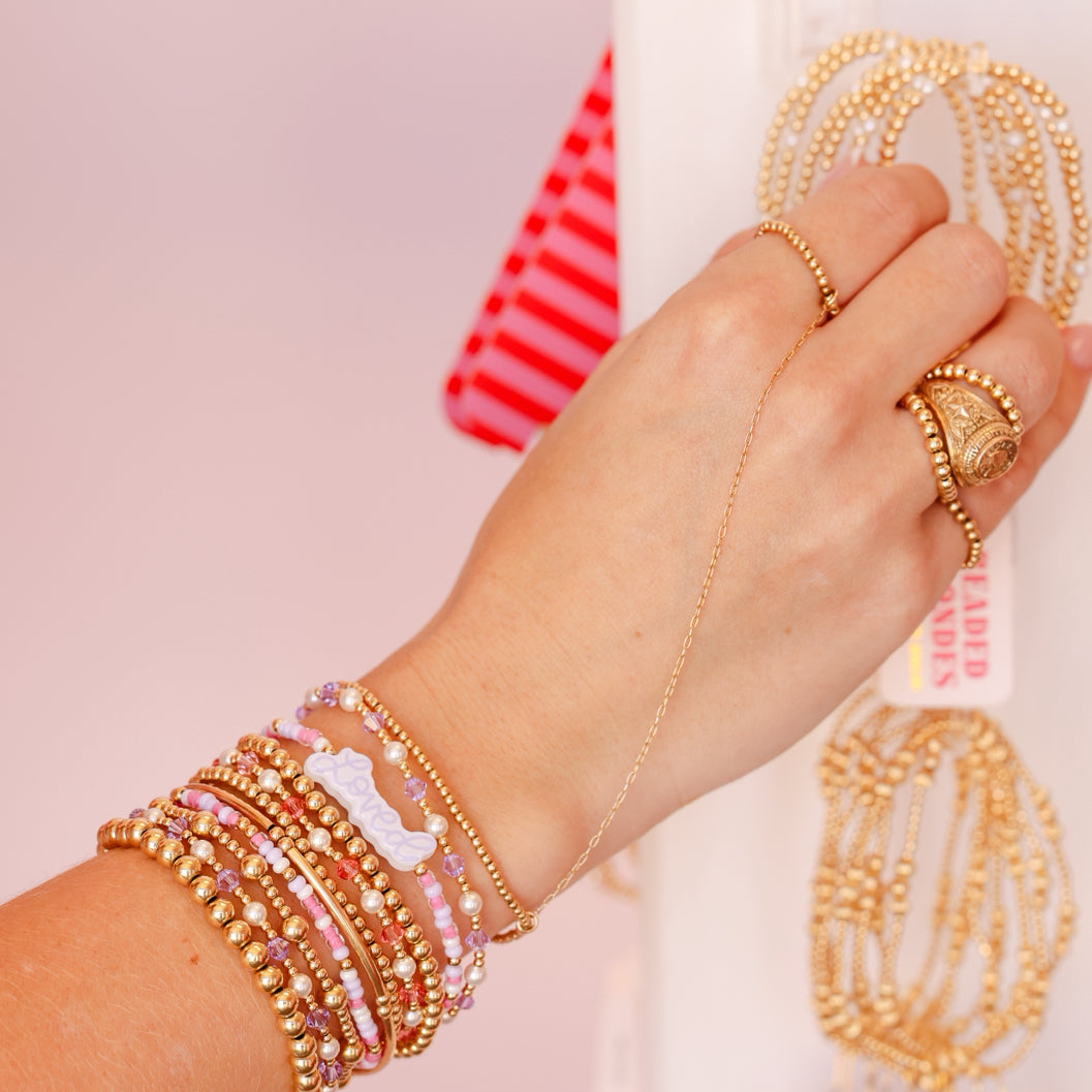 Cursive Loved Bracelet on Gold