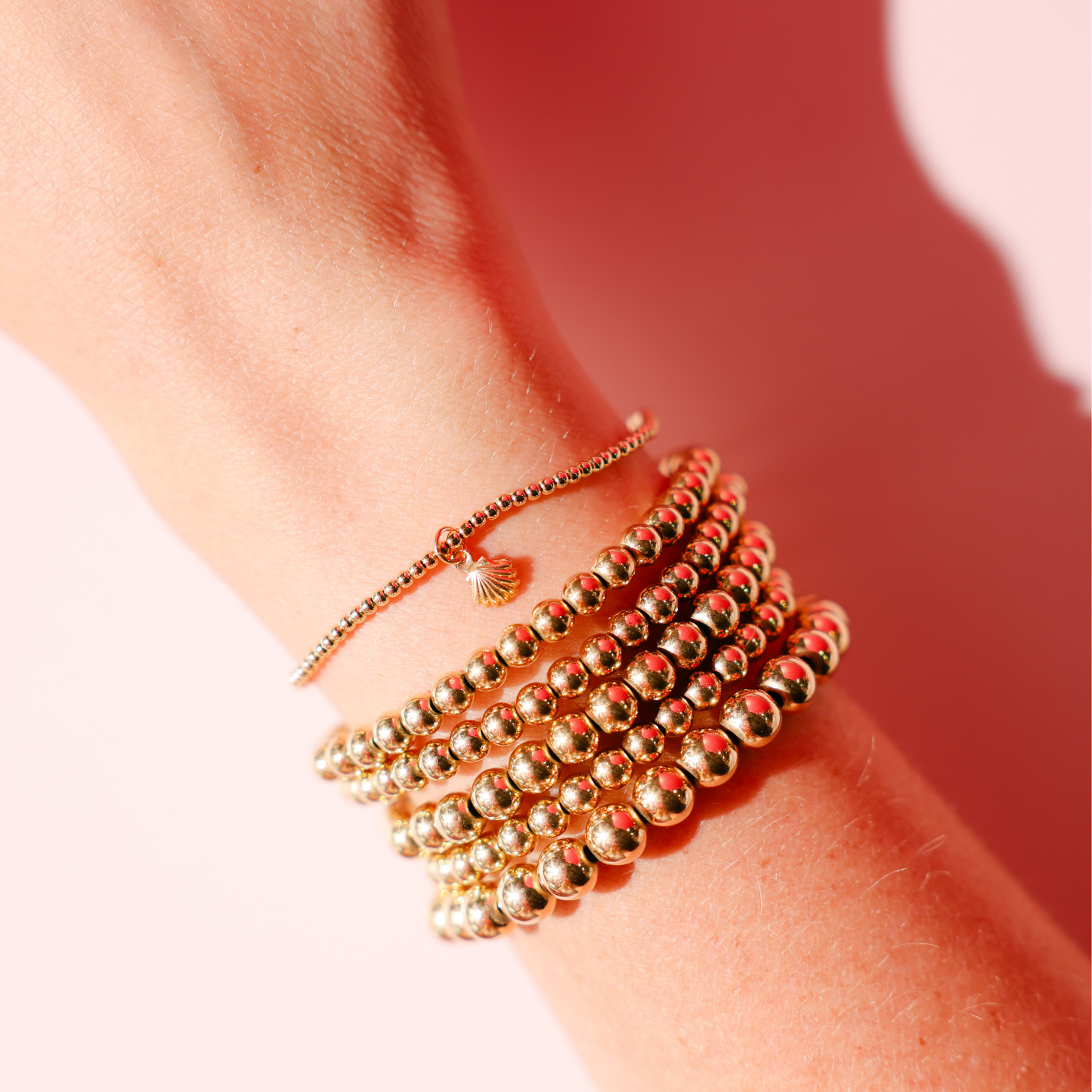 Mini Shell Charm on 2MM Gold Bracelet