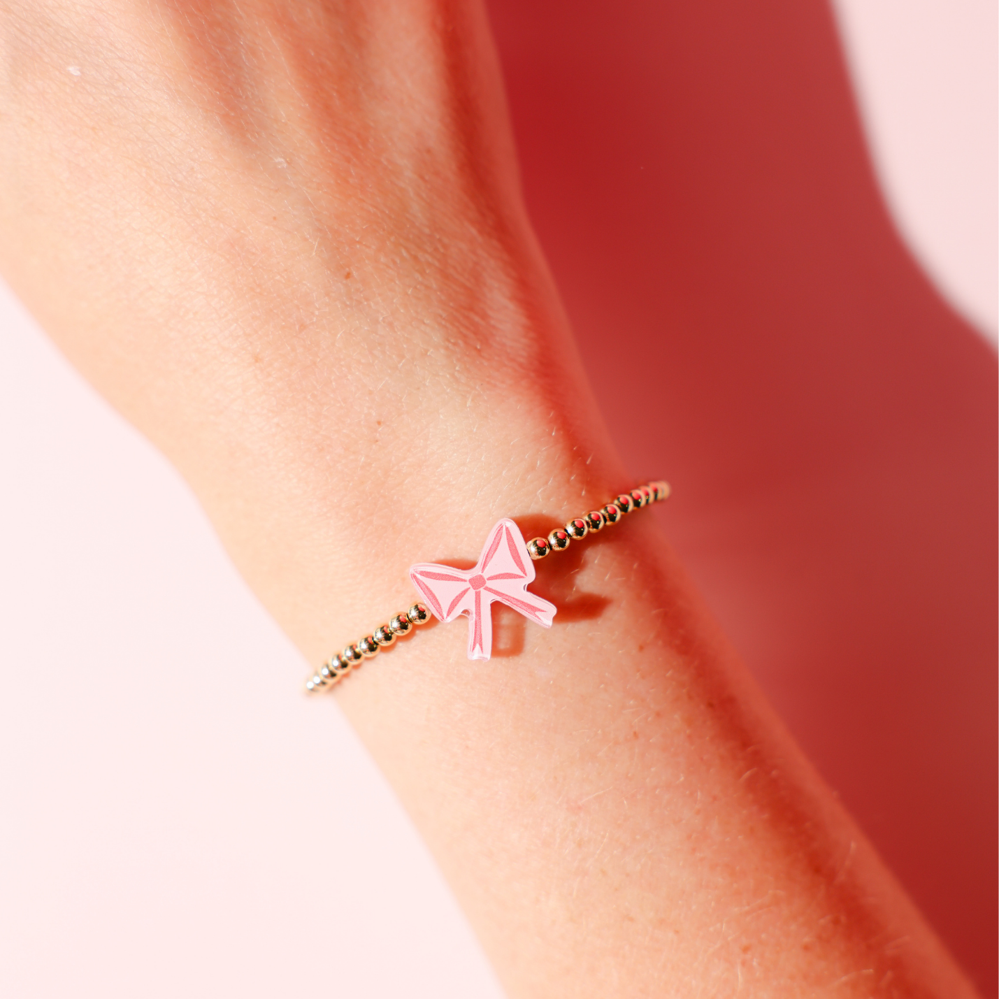 Red Bow Bracelet on Gold