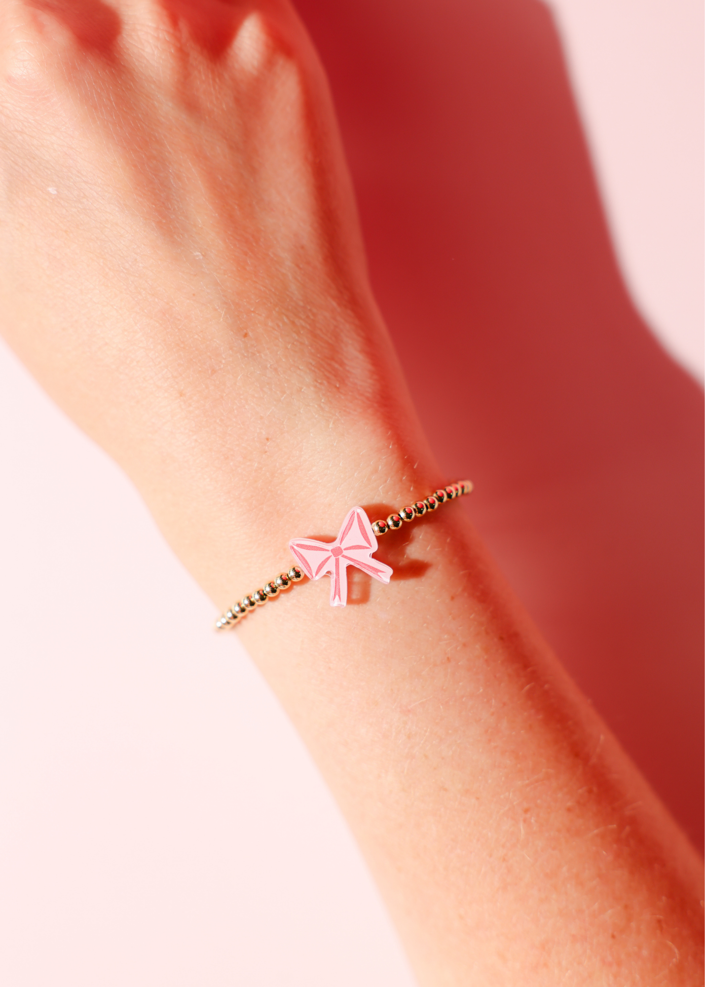 Red Bow Bracelet on Gold